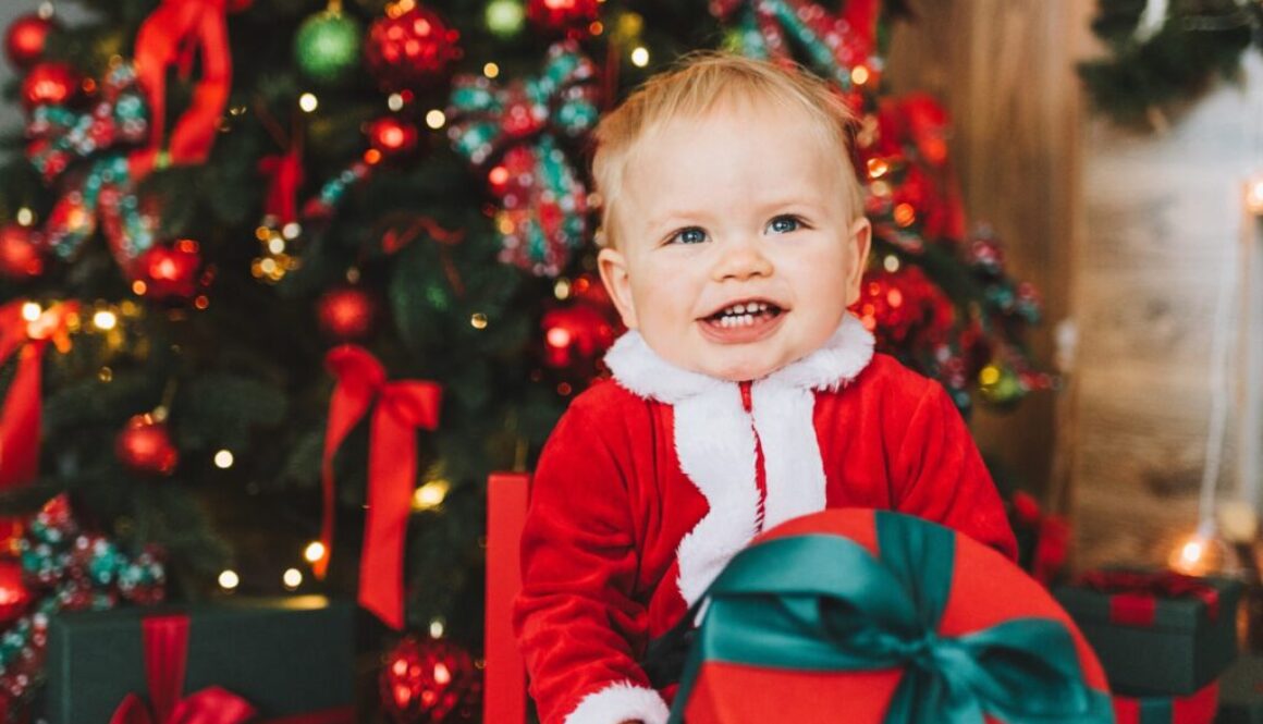 baby in red and white santa costume
