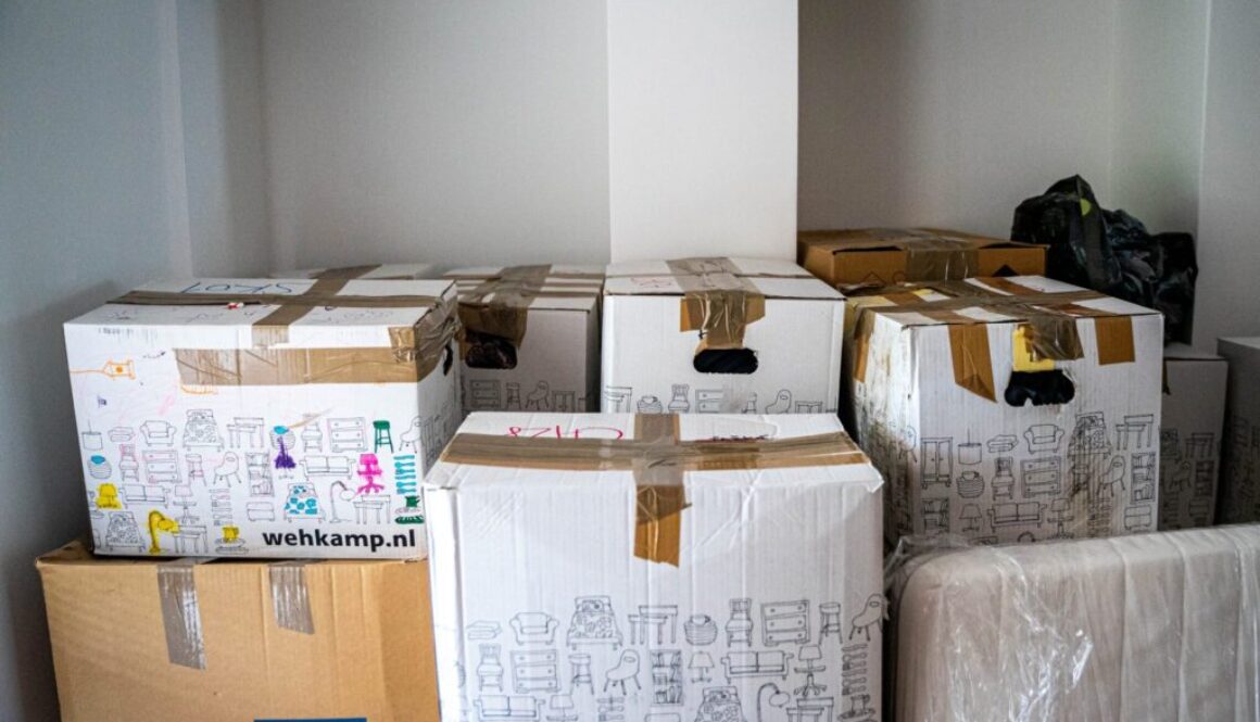 brown cardboard boxes on brown wooden table