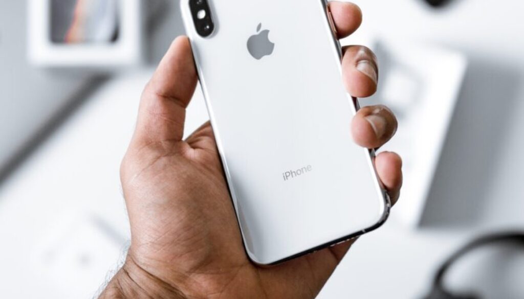 person holding silver iPhone X