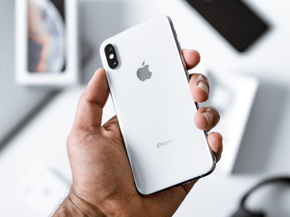 person holding silver iPhone X