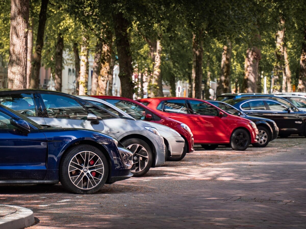 blue and red sports car on road during daytime