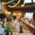 people raising wine glass in selective focus photography