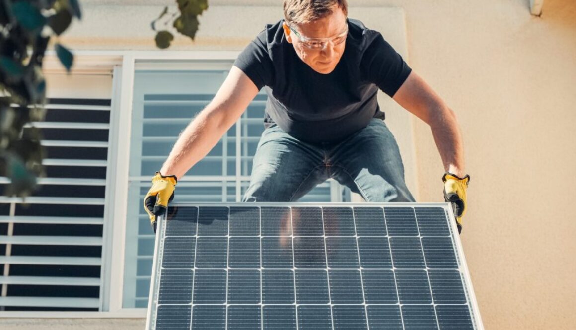 A Man Installing Solar Panel