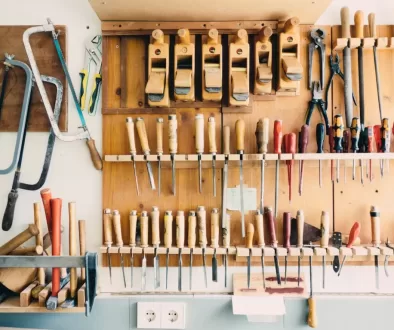 assorted handheld tools in tool rack