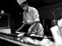 man in white chef uniform holding knife