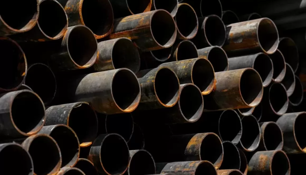 A large stack of pipes stacked on top of each other