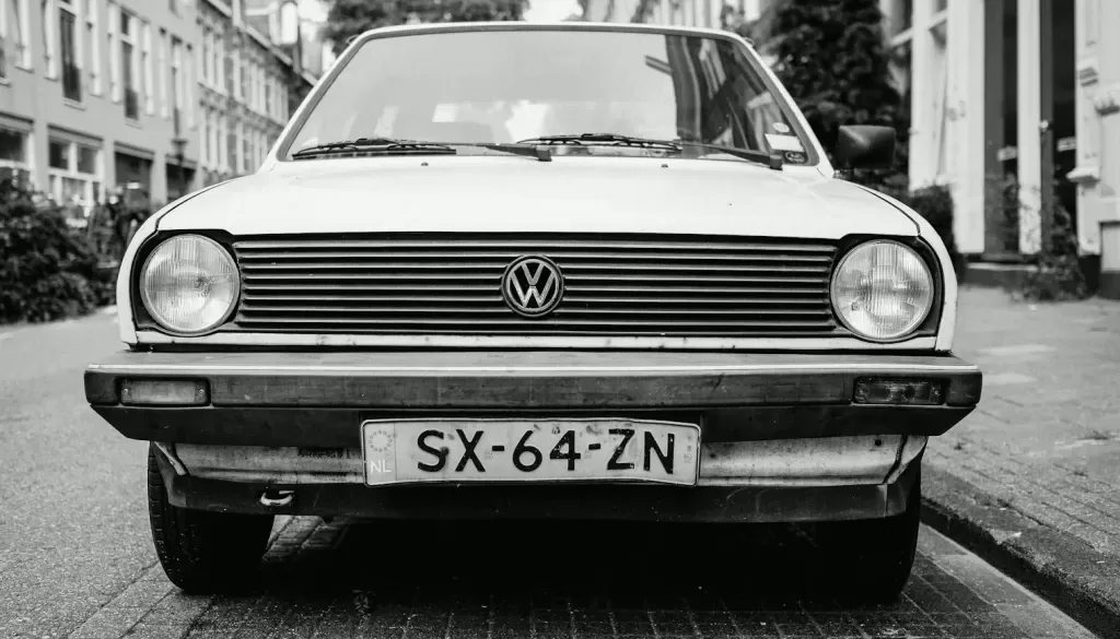 greyscale photo of white Volkswagen car