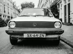 greyscale photo of white Volkswagen car