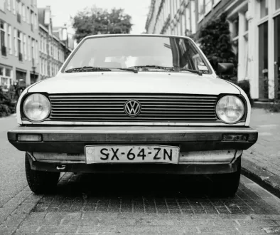 greyscale photo of white Volkswagen car